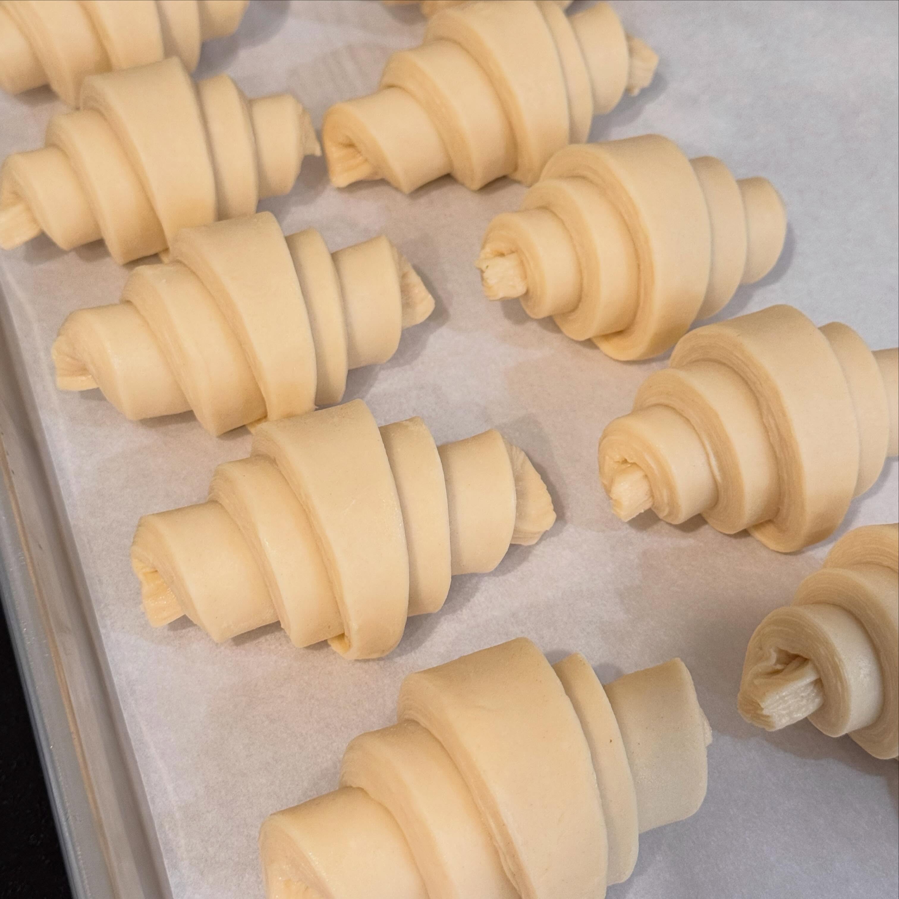 Croissant dough being shaped